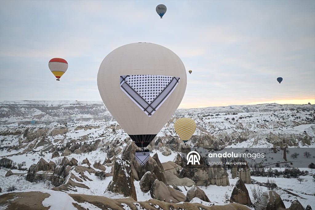 Hot air balloons with 'Palestinian keffiyeh' pattern rise above Cappadocia