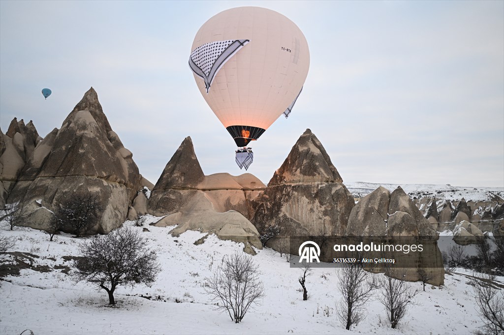 Hot air balloons with 'Palestinian keffiyeh' pattern rise above Cappadocia