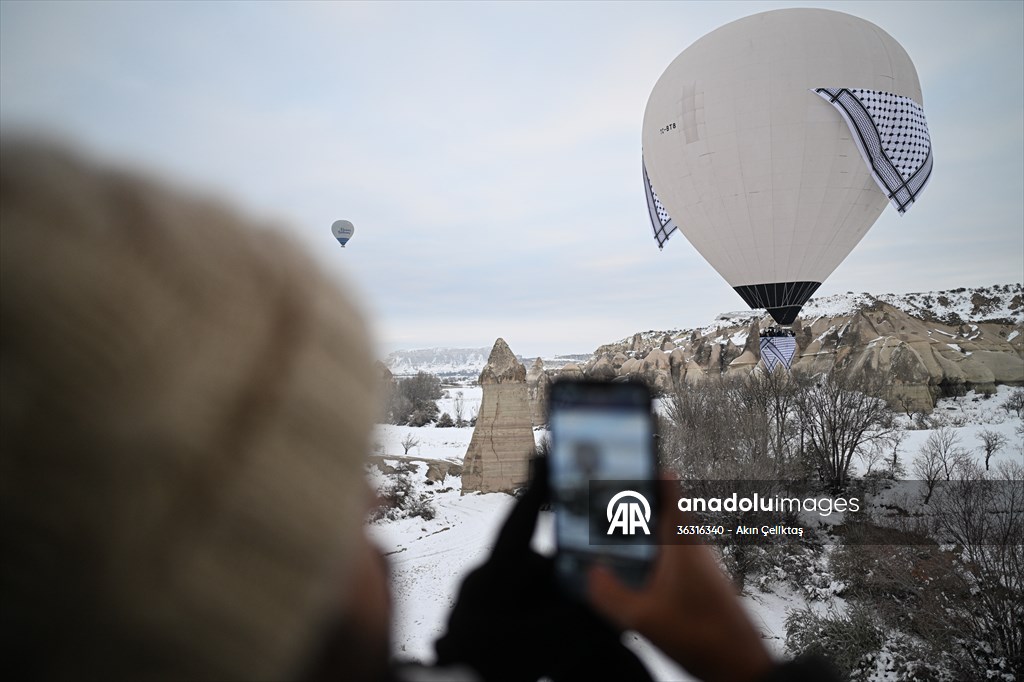 Hot air balloons with 'Palestinian keffiyeh' pattern rise above Cappadocia