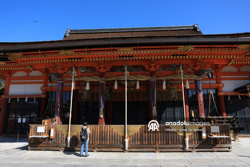 Fushimi Inari Shrine in Kyoto welcomes tourists and locals, reflecting daily life