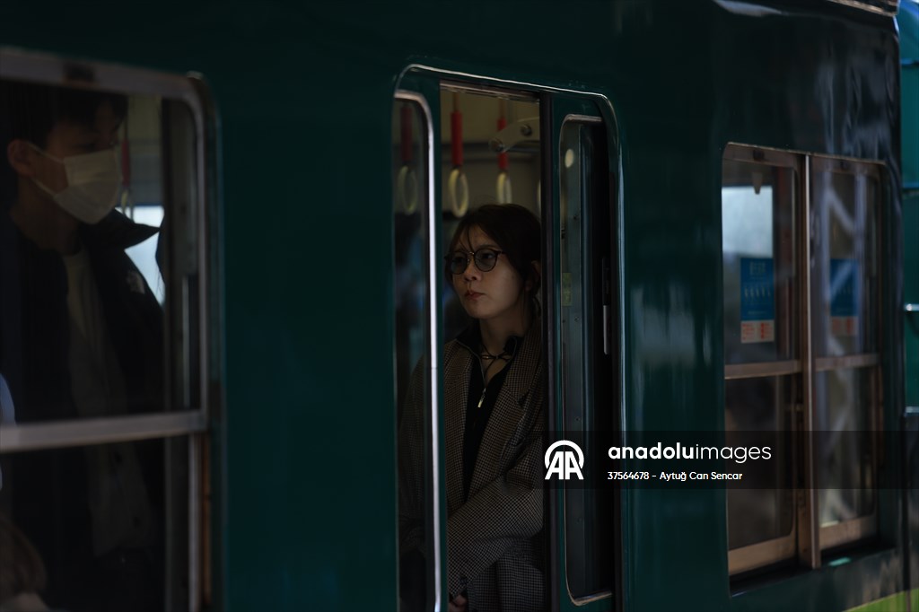 Fushimi Inari Shrine in Kyoto welcomes tourists and locals, reflecting daily life
