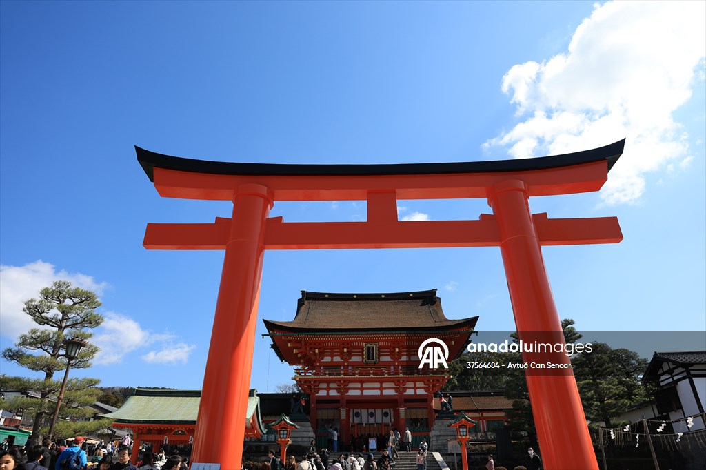 Fushimi Inari Shrine in Kyoto welcomes tourists and locals, reflecting daily life