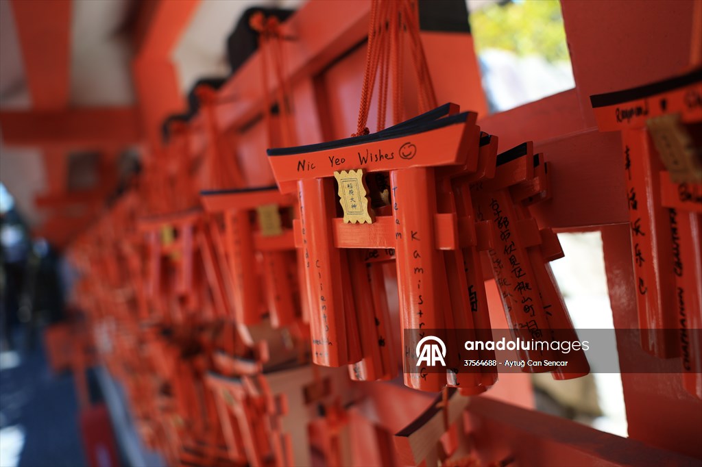 Fushimi Inari Shrine in Kyoto welcomes tourists and locals, reflecting daily life