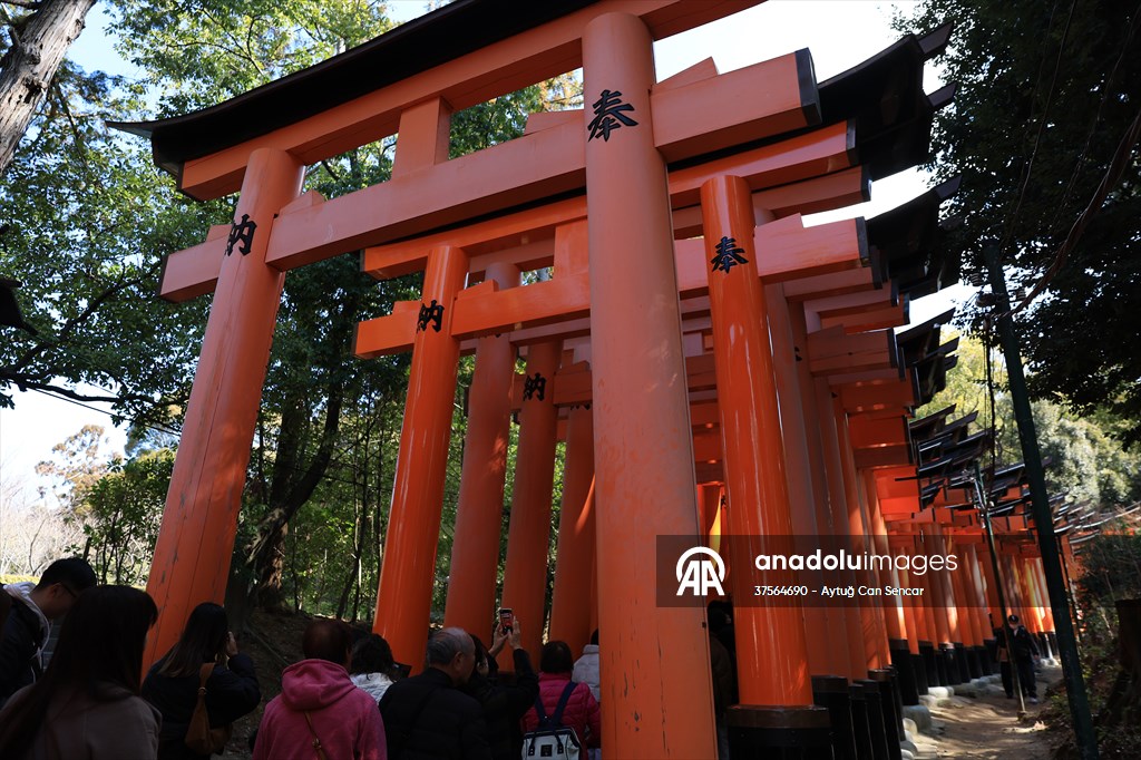 Fushimi Inari Shrine in Kyoto welcomes tourists and locals, reflecting daily life