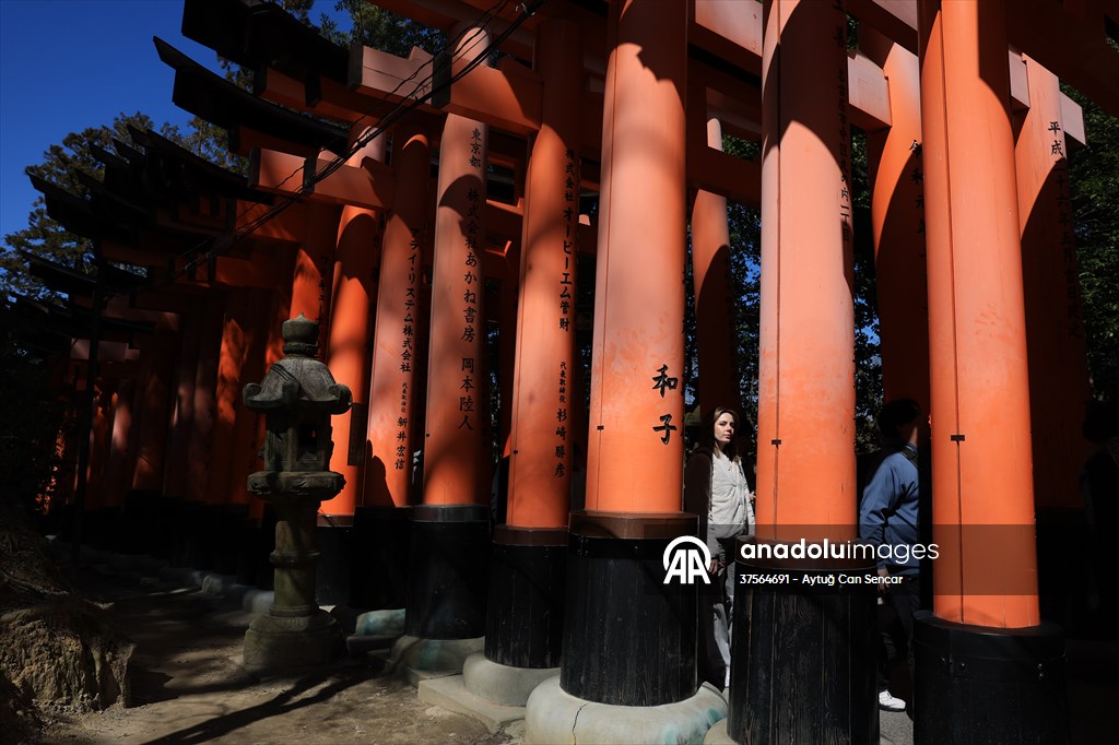 Fushimi Inari Shrine in Kyoto welcomes tourists and locals, reflecting daily life