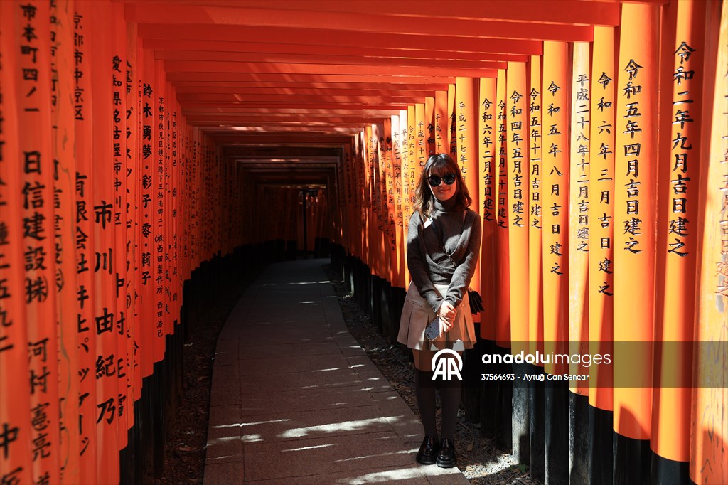 Fushimi Inari Shrine in Kyoto welcomes tourists and locals, reflecting daily life