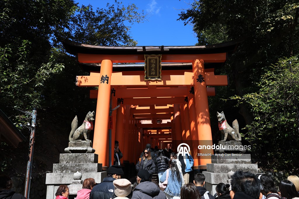 Fushimi Inari Shrine in Kyoto welcomes tourists and locals, reflecting daily life