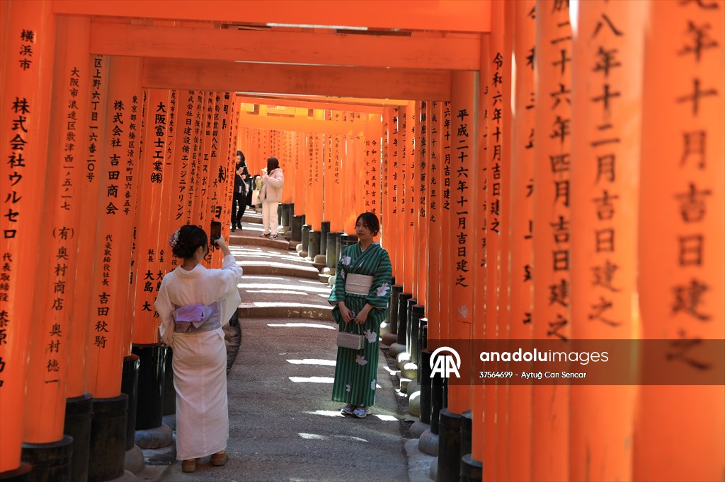 Fushimi Inari Shrine in Kyoto welcomes tourists and locals, reflecting daily life