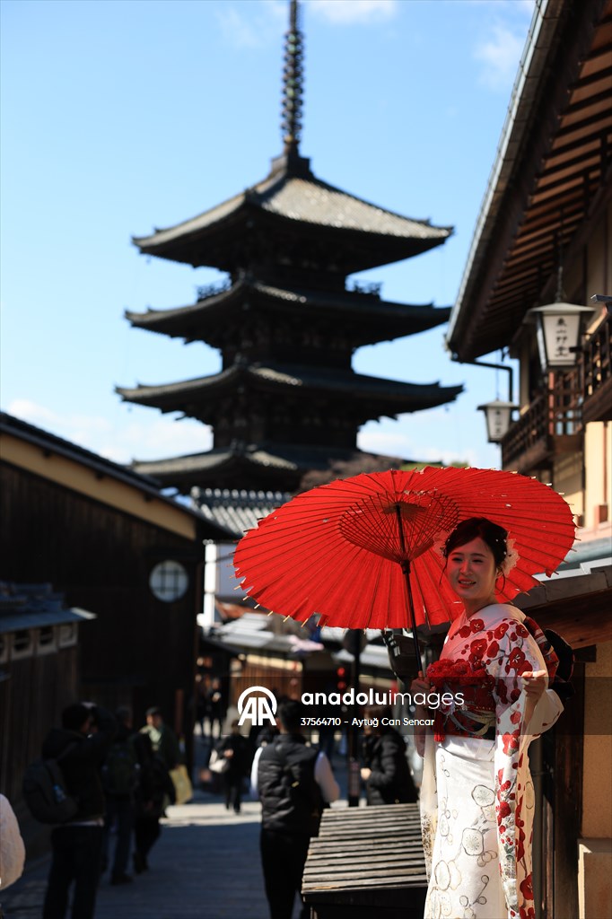 Fushimi Inari Shrine in Kyoto welcomes tourists and locals, reflecting daily life