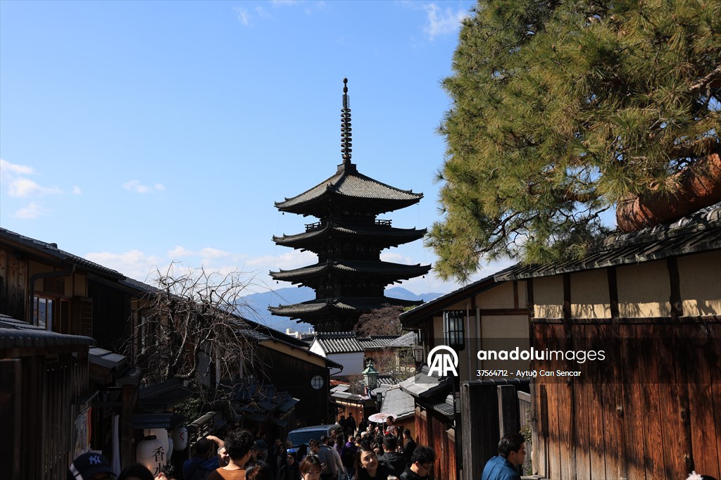 Fushimi Inari Shrine in Kyoto welcomes tourists and locals, reflecting daily life