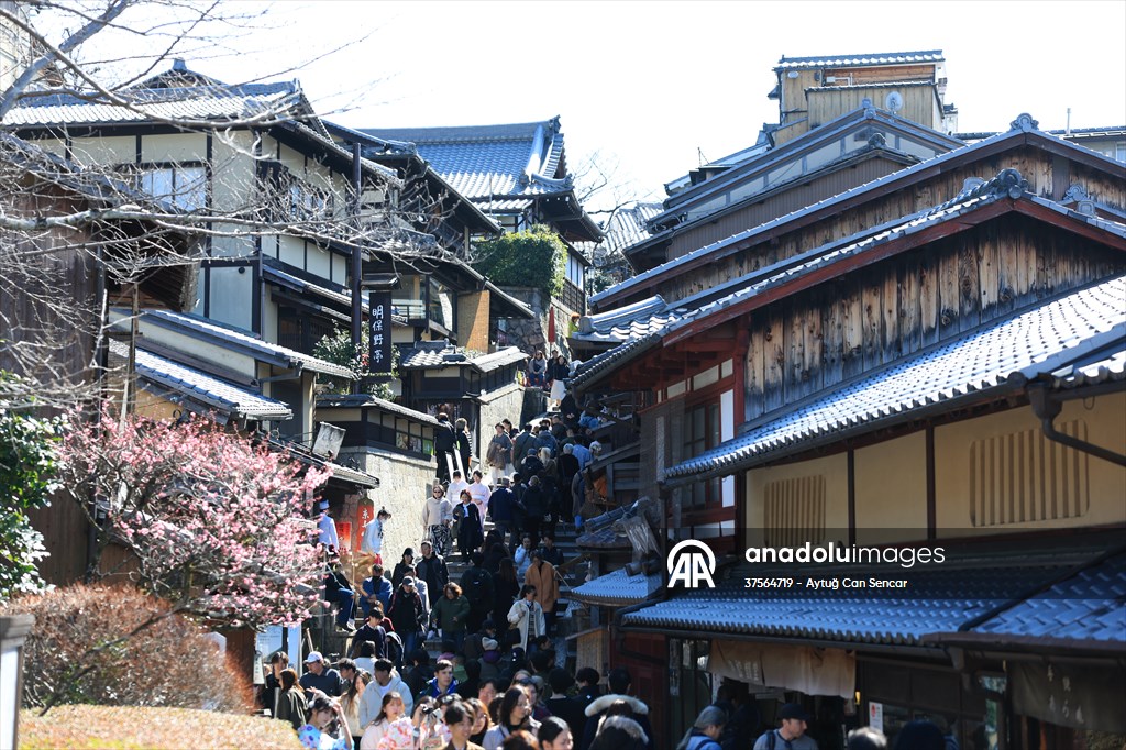 Fushimi Inari Shrine in Kyoto welcomes tourists and locals, reflecting daily life