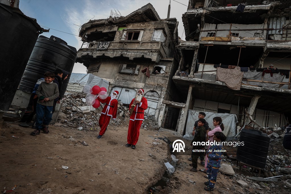 Volunteers dressed as Santa bring joy to children in Gaza