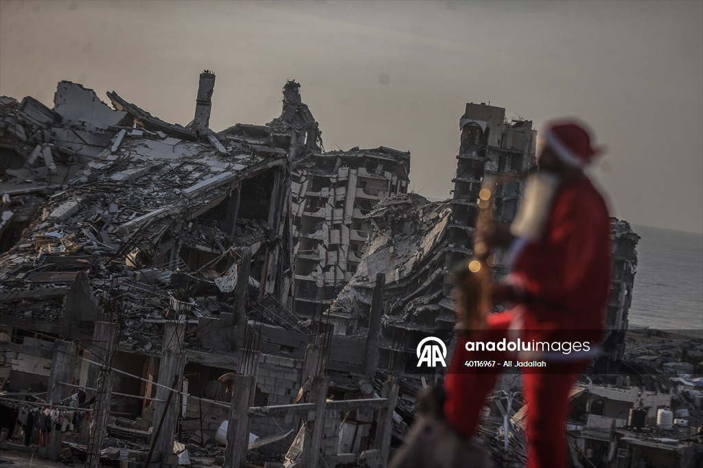Volunteers dressed as Santa bring joy to children in Gaza