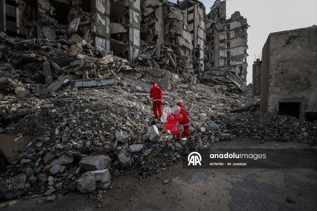 Volunteers dressed as Santa bring joy to children in Gaza