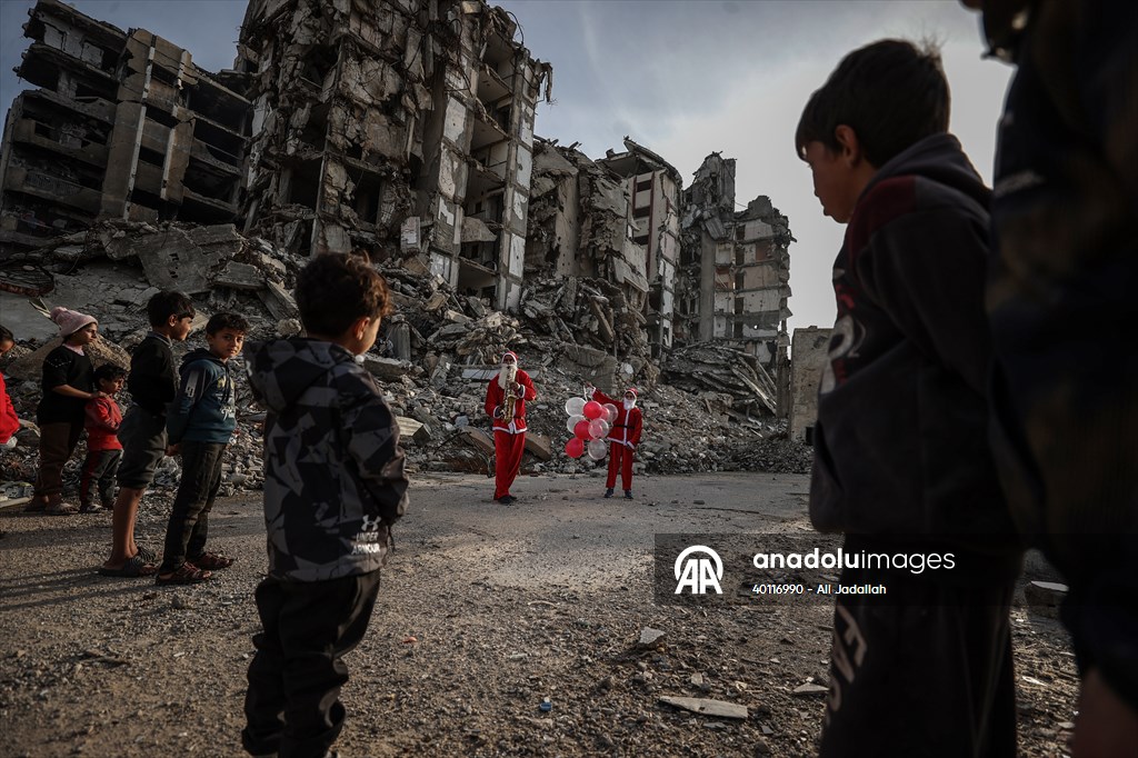 Volunteers dressed as Santa bring joy to children in Gaza