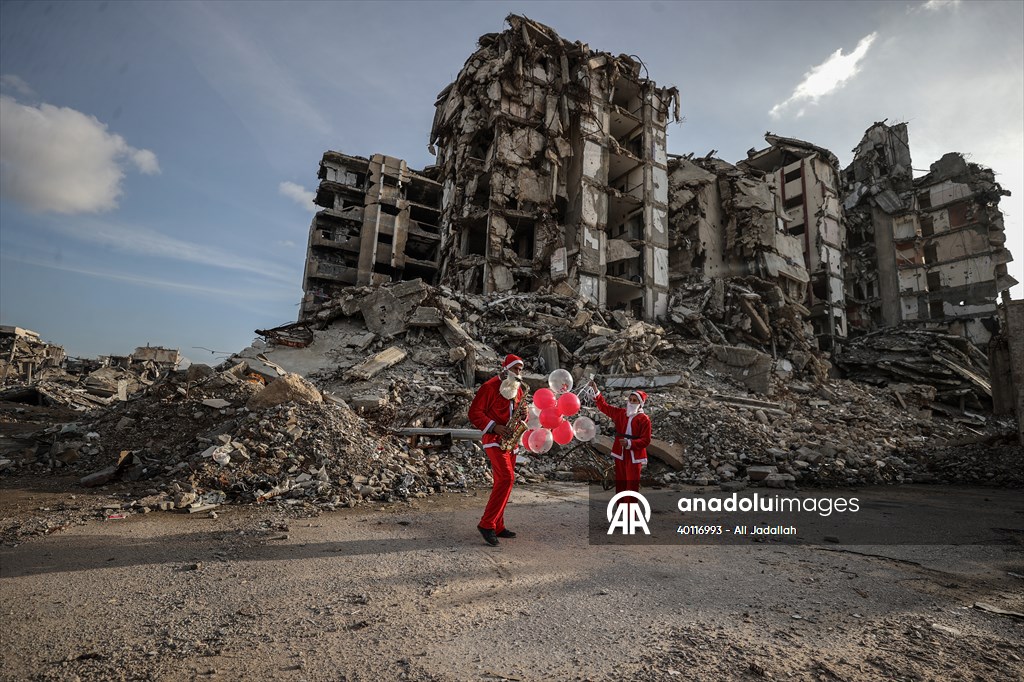 Volunteers dressed as Santa bring joy to children in Gaza