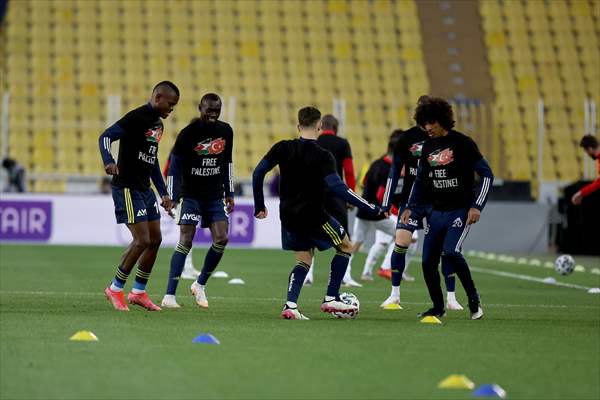 Players of Fenerbahce and Demir Grup Sivasspor wear t-shirts to support Palestinians