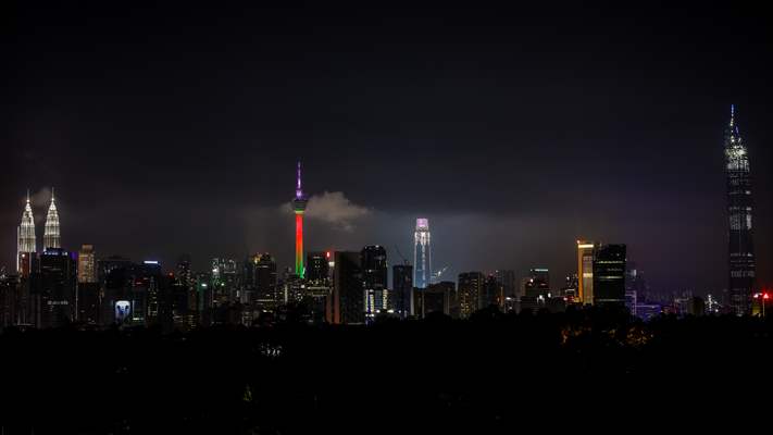 KL Tower illuminated with Palestinian flag's colors to show solidarity