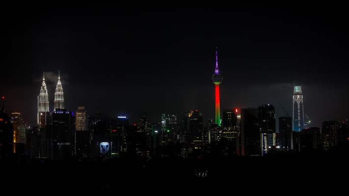KL Tower illuminated with Palestinian flag's colors to show solidarity