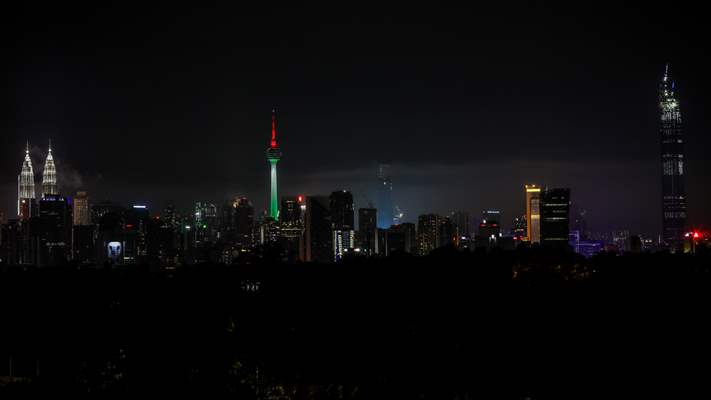 KL Tower illuminated with Palestinian flag's colors to show solidarity