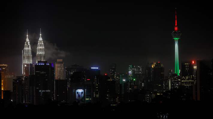 KL Tower illuminated with Palestinian flag's colors to show solidarity