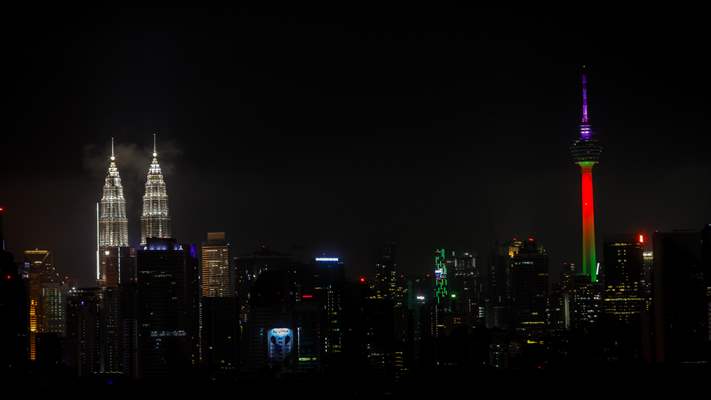 KL Tower illuminated with Palestinian flag's colors to show solidarity