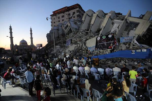 Palestinian musicians in Gaza perform concert in front of debris of buildings