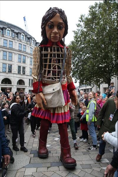 Little Amal, symbol of child refugees, reaches London