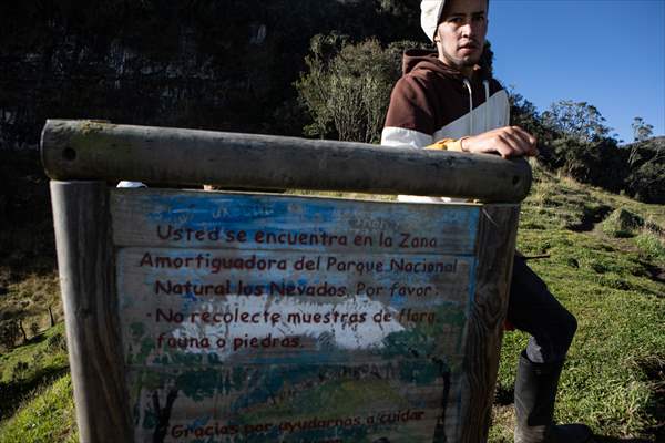 Tourists ascend to the hot springs lagoons of the Nevado del Rui