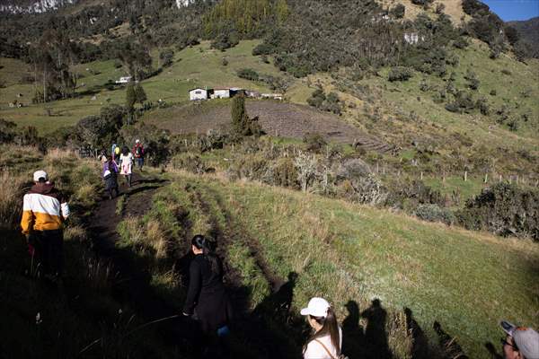 Tourists ascend to the hot springs lagoons of the Nevado del Rui