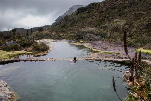 Tourists ascend to the hot springs lagoons of the Nevado del Rui