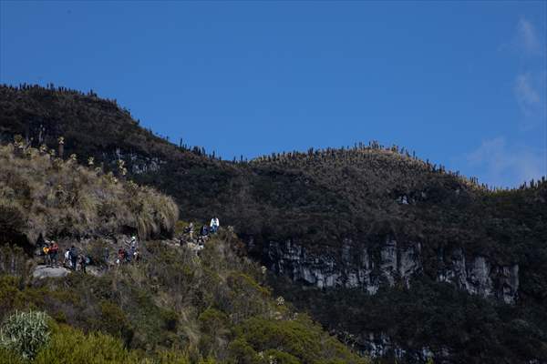 Tourists ascend to the hot springs lagoons of the Nevado del Rui