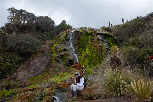 Tourists ascend to the hot springs lagoons of the Nevado del Rui