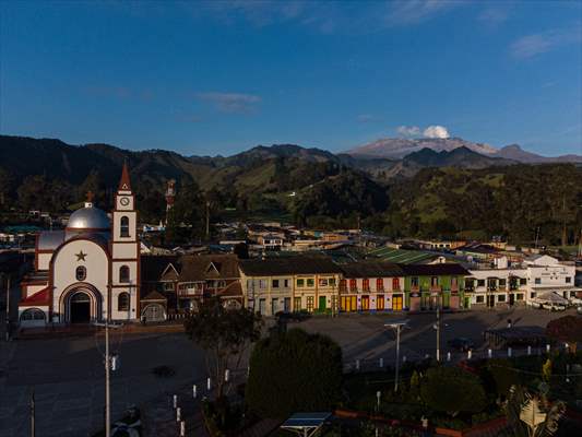 Tourists ascend to the hot springs lagoons of the Nevado del Rui