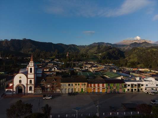 Tourists ascend to the hot springs lagoons of the Nevado del Rui