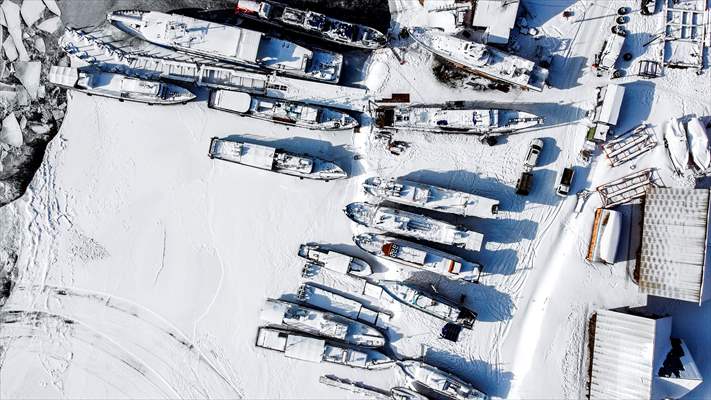 Boats and ships stranded on the frozen Lake Baikal