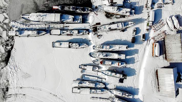 Boats and ships stranded on the frozen Lake Baikal