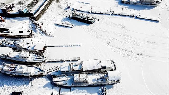 Boats and ships stranded on the frozen Lake Baikal