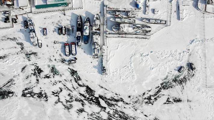 Boats and ships stranded on the frozen Lake Baikal