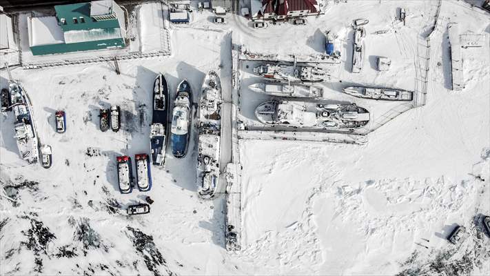 Boats and ships stranded on the frozen Lake Baikal