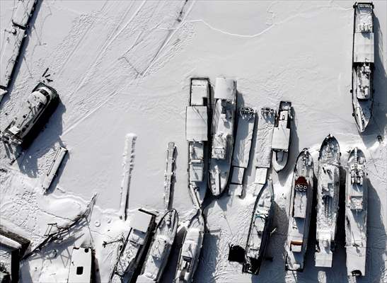 Boats and ships stranded on the frozen Lake Baikal