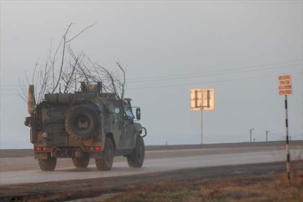A convoy of Russian military vehicles moving towards border in Donbas region