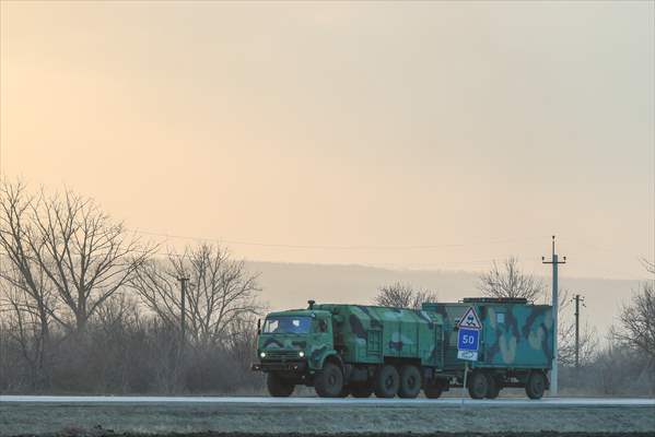 A convoy of Russian military vehicles moving towards border in Donbas region