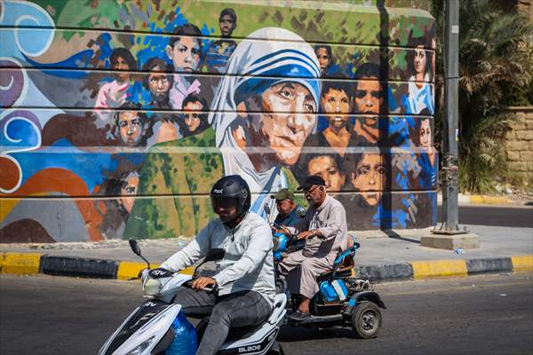 The walls of Baghdad are colored by murals of Iraqi artists