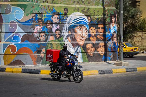 The walls of Baghdad are colored by murals of Iraqi artists