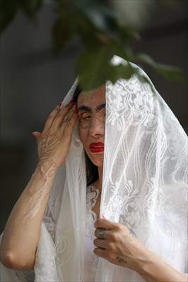 Acid attack victims model for Iranian fashion designer