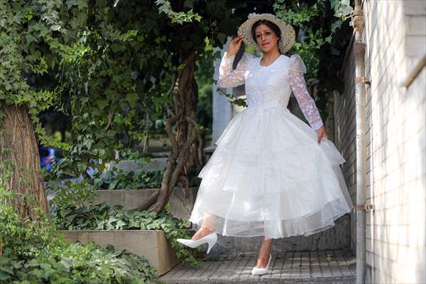 Acid attack victims model for Iranian fashion designer