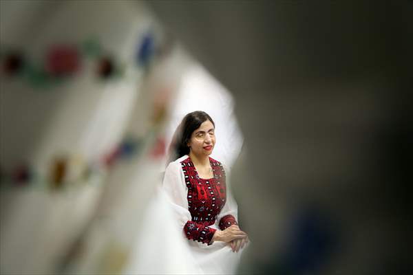 Acid attack victims model for Iranian fashion designer