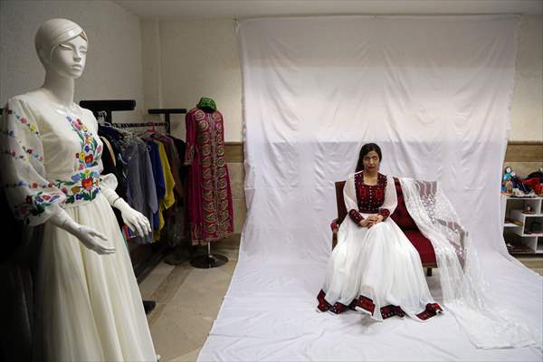Acid attack victims model for Iranian fashion designer