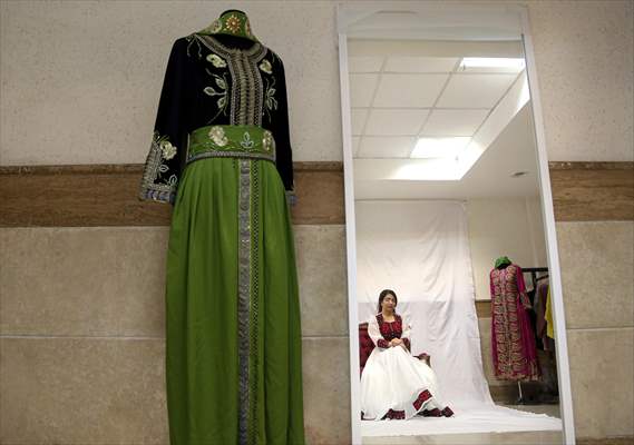 Acid attack victims model for Iranian fashion designer